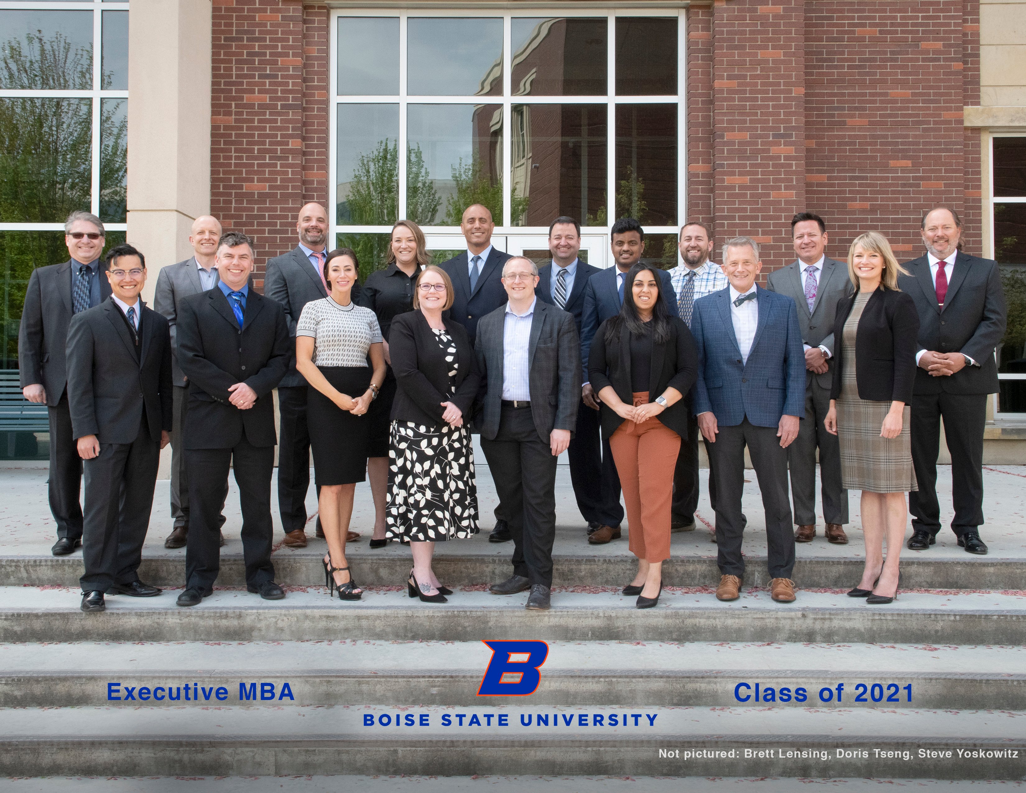 Colin Casillas with his 2021 MBA cohort at Boise State University, outdoors on campus in business formal attire